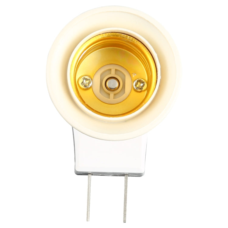E27 socket interior with brass contacts in a white lamp holder base