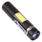 Black USB-rechargeable pocket flashlight with side USB port and textured grip