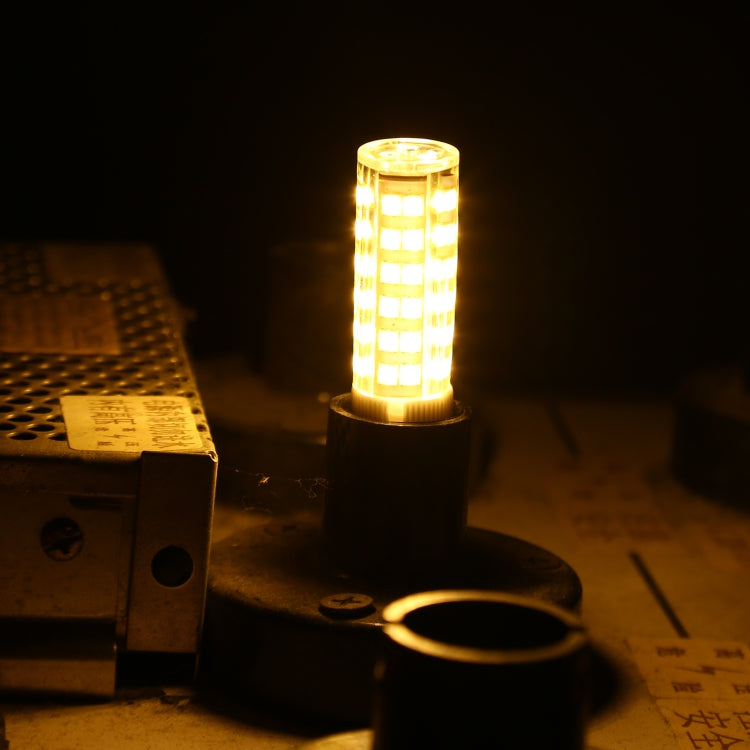 E14 LED corn bulb glowing warmly, clear cover with multiple SMD LEDs