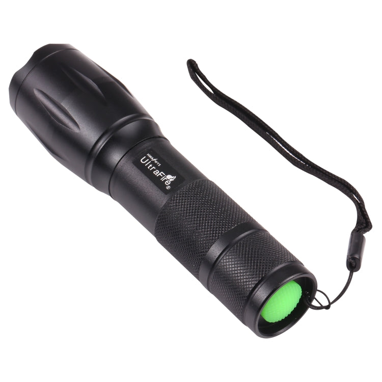 Black zoomable flashlight with bright green front bezel and wrist strap
