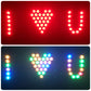 Remote-controlled LED cylinder light showing red heart and multicolor letter dot displays