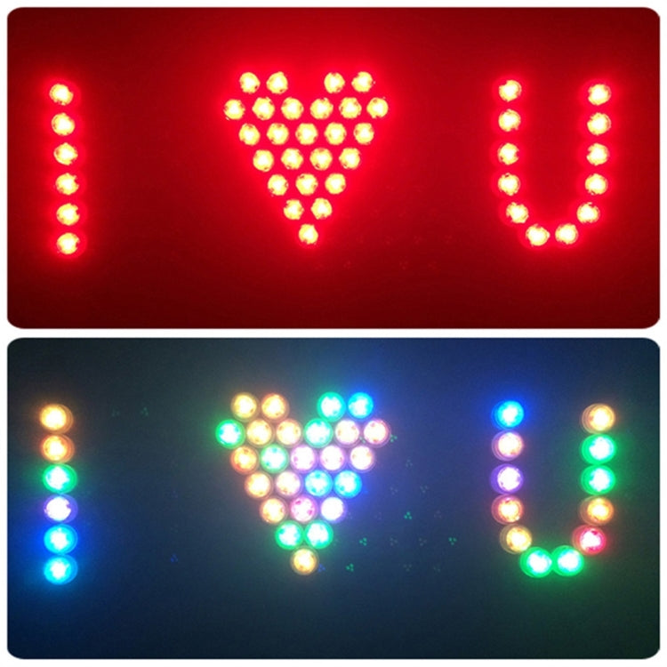 Remote-controlled LED cylinder light showing red heart and multicolor letter dot displays