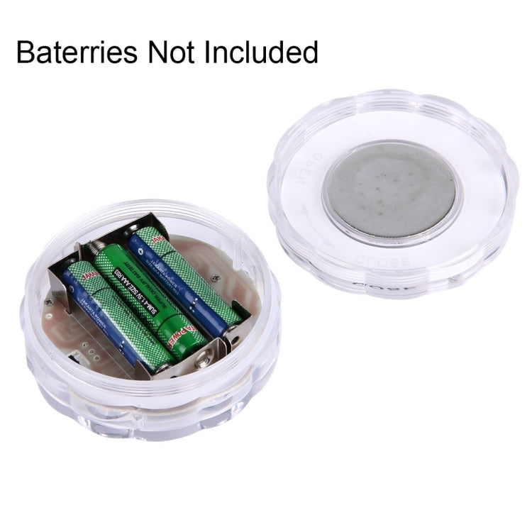 Open clear LED cylinder showing battery compartment with two battery slots