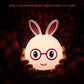White 3D LED rabbit night light with glowing pink-red glasses and smiling face