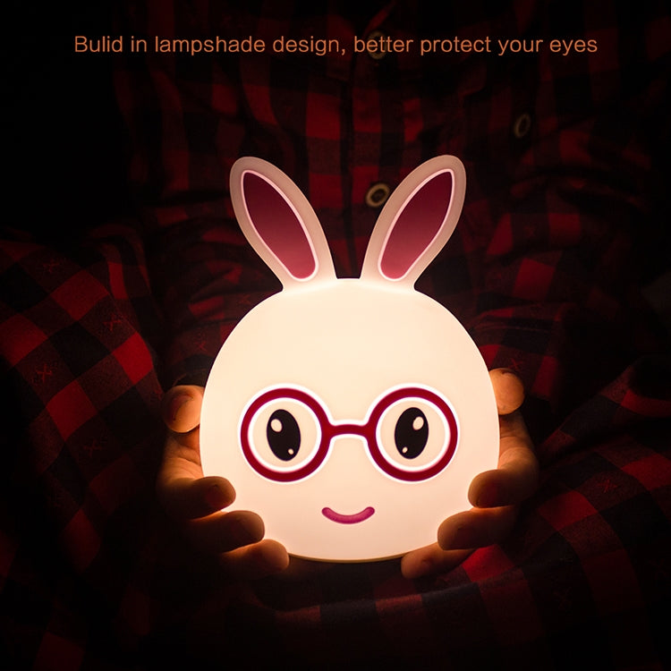 White 3D LED rabbit night light with glowing pink-red glasses and smiling face
