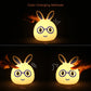 Color-changing LED rabbit night light glowing yellow, smiling face and glasses