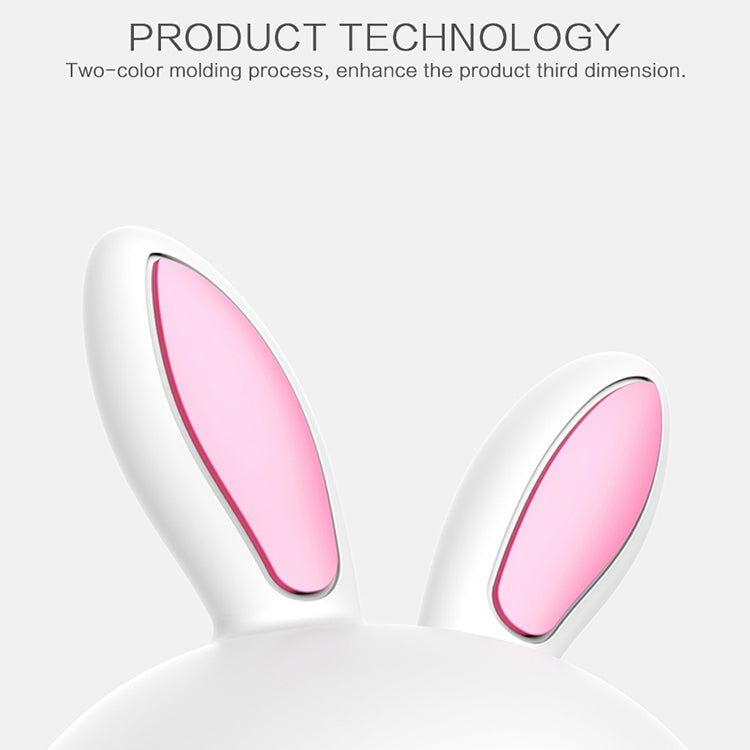 White rabbit 3D LED night light with pink ear interiors, close-up upper half