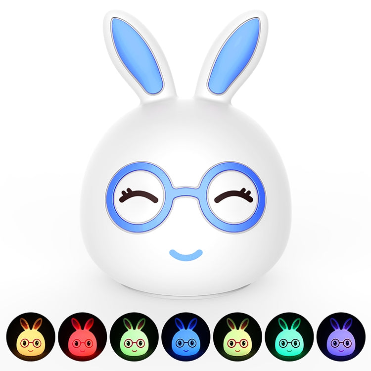White 3D LED rabbit night light with blue inner ears and round glasses, close-up
