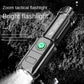 Silver telescopic flashlight with green indicator light on the side panel.