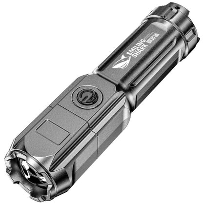Telescopic flashlight with zoom head and side control, silver metallic body.
