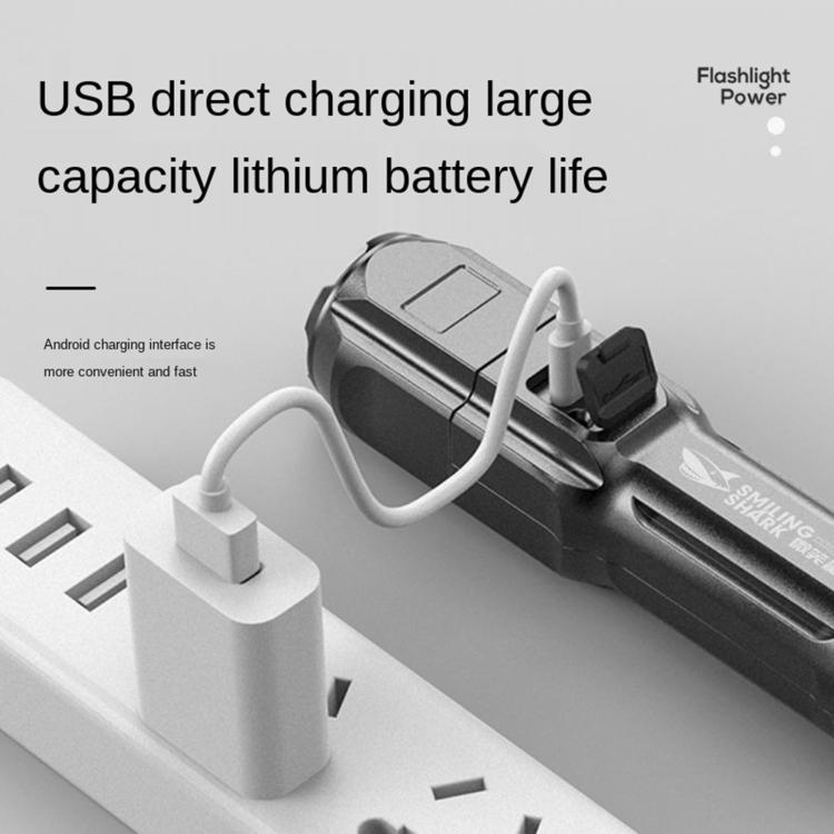 Flashlight with USB direct charging port connected to a white power adapter.