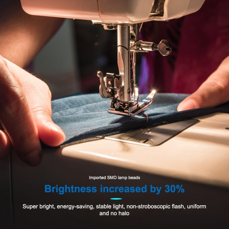LED sewing lamp illuminating fabric during sewing on a machine