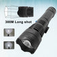 Black LED mini flashlight with wide head lens and ribbed grip, beam shown.
