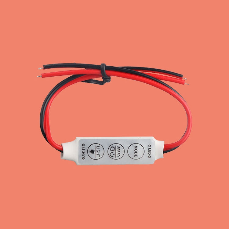 LED strip controller with white housing, red/black wires looped and cable tied