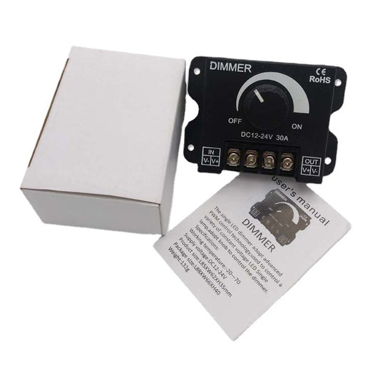 Black dimmer knob module with white mounting box and included instruction card