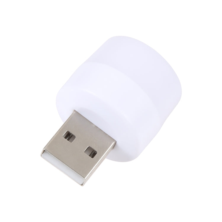 Round LED USB mini night light, white cap with silver USB connector shown up close