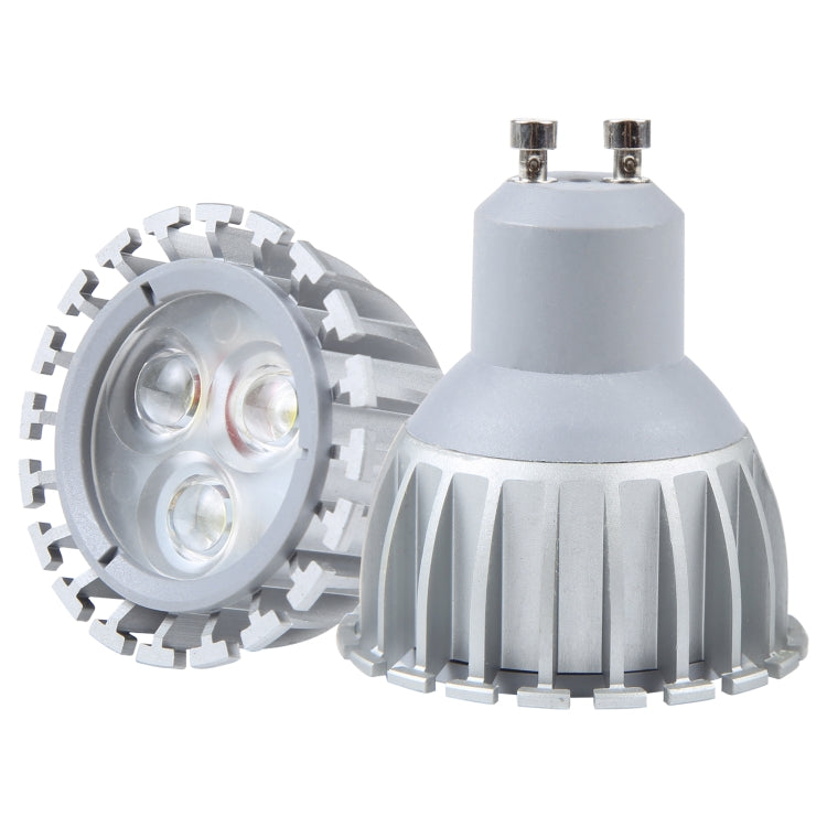 White GU10 LED spotlight with round heat sink and two pins, angled view