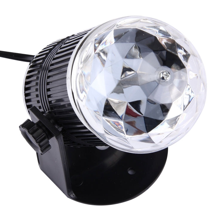 Black mini rotating LED stage light with large clear disco ball lens and vented body