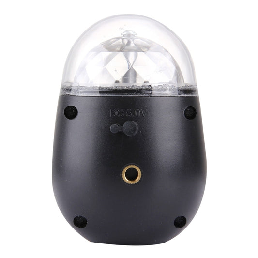 Black LED light with clear dome, side button, and gold charging port