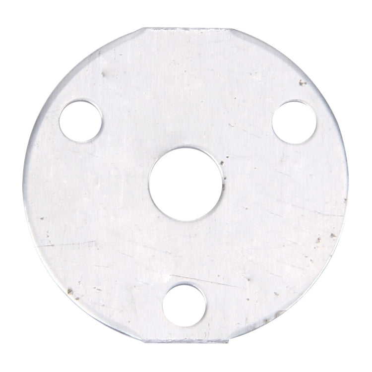 Circular metal mounting plate with cutouts and mounting holes for an LED module