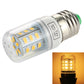 Clear E27 LED bulb with green cap, glowing warm white light inset