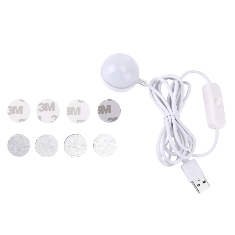LED puck light with adhesive pads and USB cable