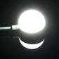 LED puck light emitting bright white light with attached cable