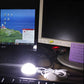 Lit USB LED puck light on device surface