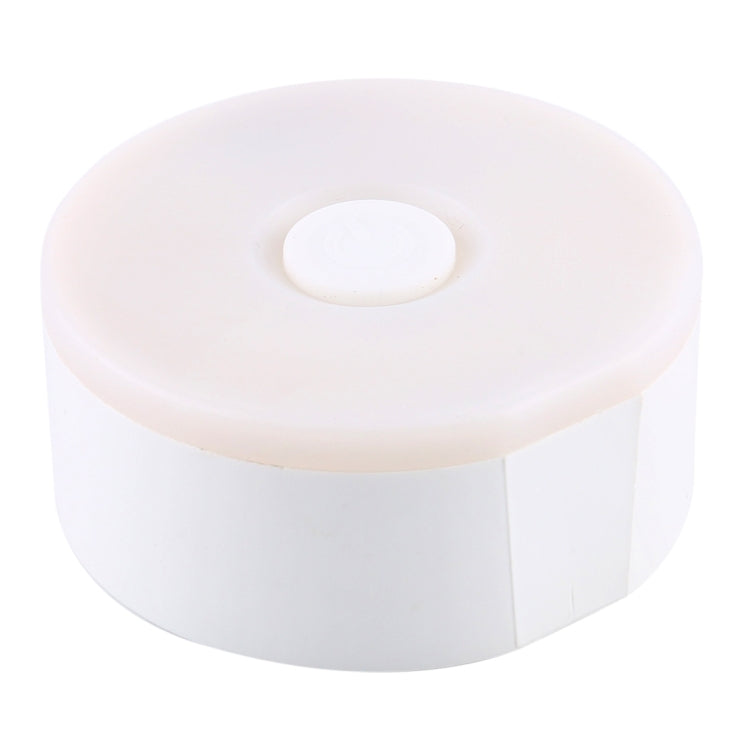 White round LED night light with oval top button and side profile