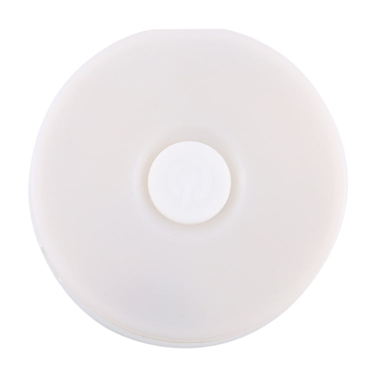 White round LED night light with centered circular top button