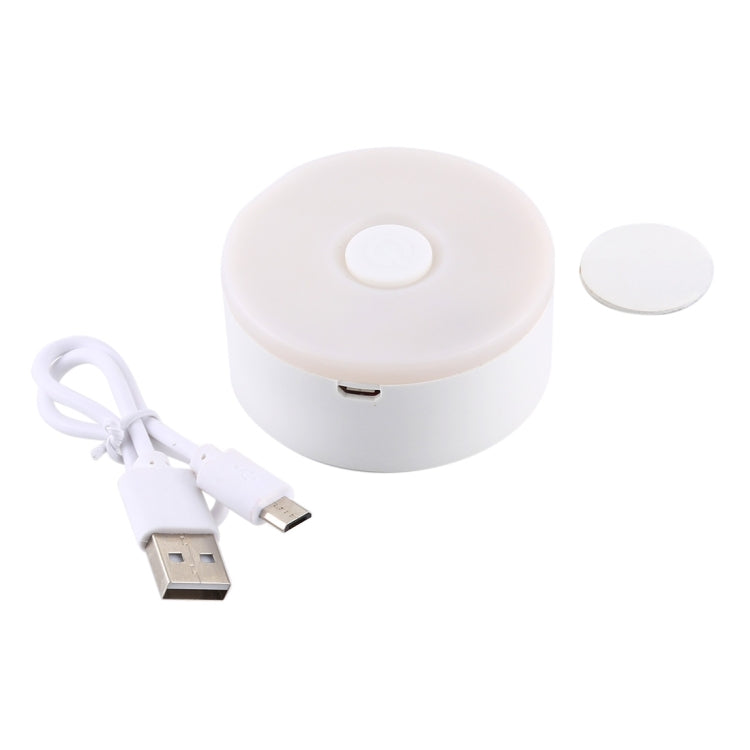 White round LED night light with USB charging cable and top button