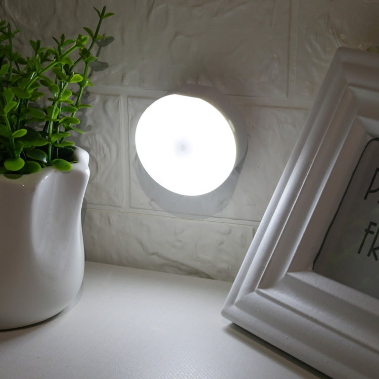 Glowing white round LED night light with centered light-emitting circle