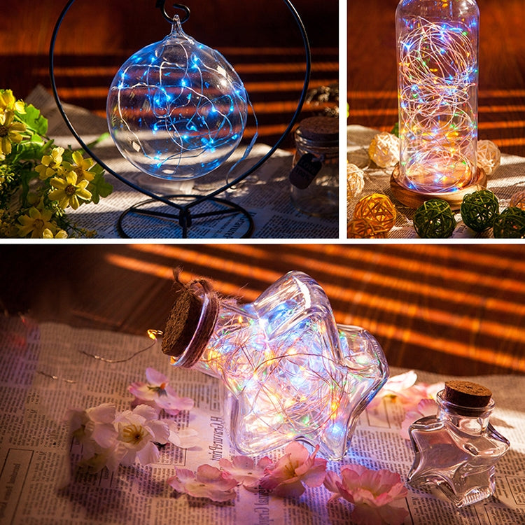 Blue LED fairy lights in glass dome jar and bottle, glowing wire strands