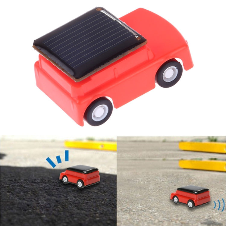 Red solar toy jeep car with roof solar panel and small wheels visible