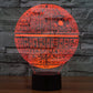 Red glowing Death Star style dome desk lamp with circuit pattern on black base