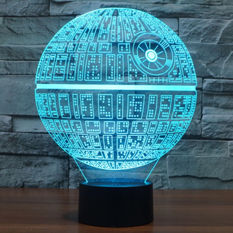 Teal glowing Death Star style dome desk lamp with circuit pattern on black base