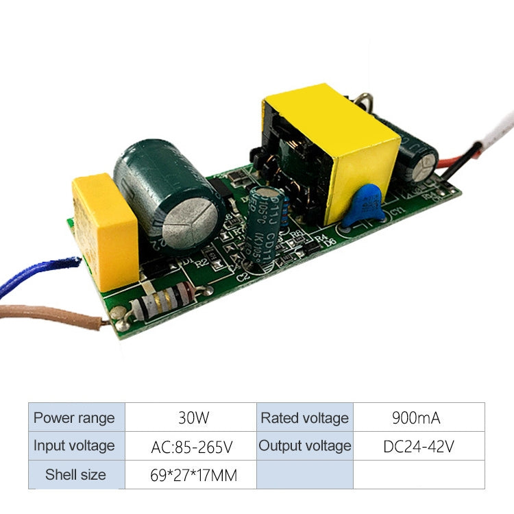 Isolated LED driver PCB with yellow transformer, large green capacitor, and DC leads