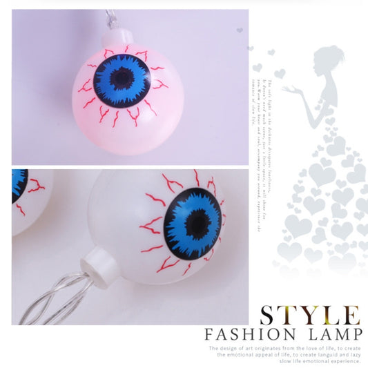 Single eyeball LED lamp bulb with pink face, blue eye, and red lashes