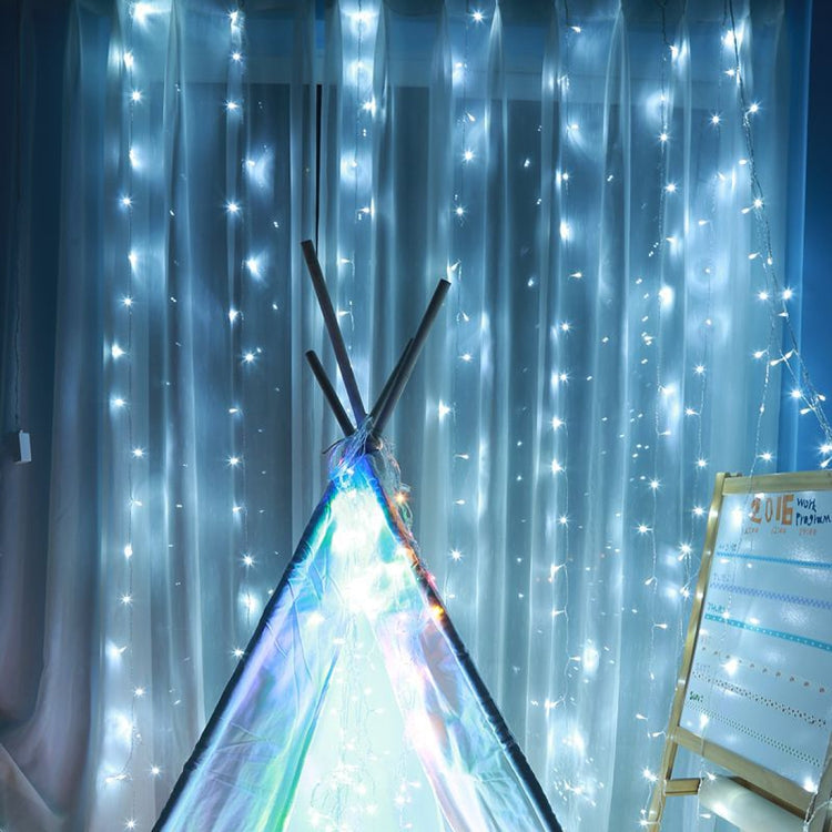 LED curtain string lights hanging vertically with bright blue glow.