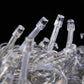 Close-up of clear LED bulbs on a transparent curtain light string