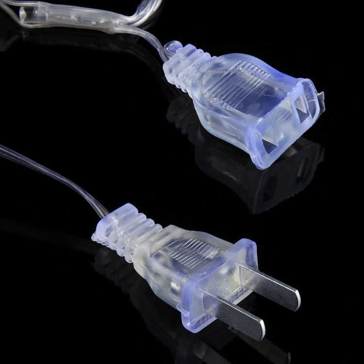 Transparent two-prong plug and clear LED bulb connectors on string lights