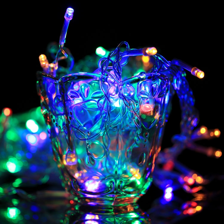 Colorful LED reticular string lights glowing on clear wires