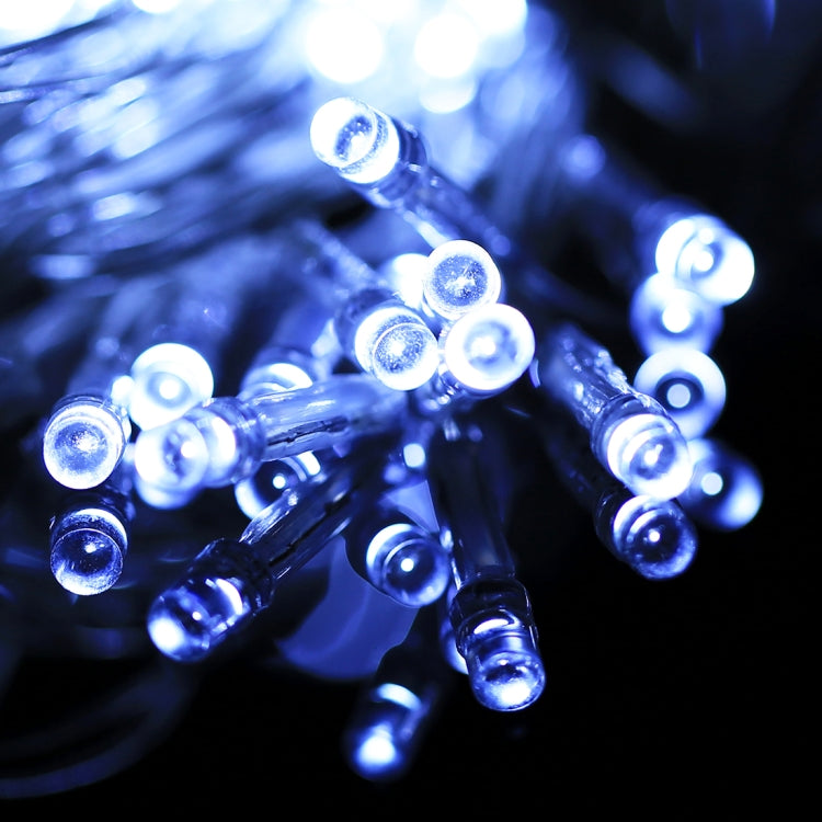 Reticular string lights with bright blue LED bulbs on clear wire strand