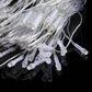 Close-up of clear LED bulbs on transparent string light wiring