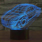 Car-shaped wireframe desk lamp, blue glow with round headlights and side stripes