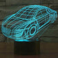 Car-shaped 3D LED night light lamp with teal wireframe glow on round black base