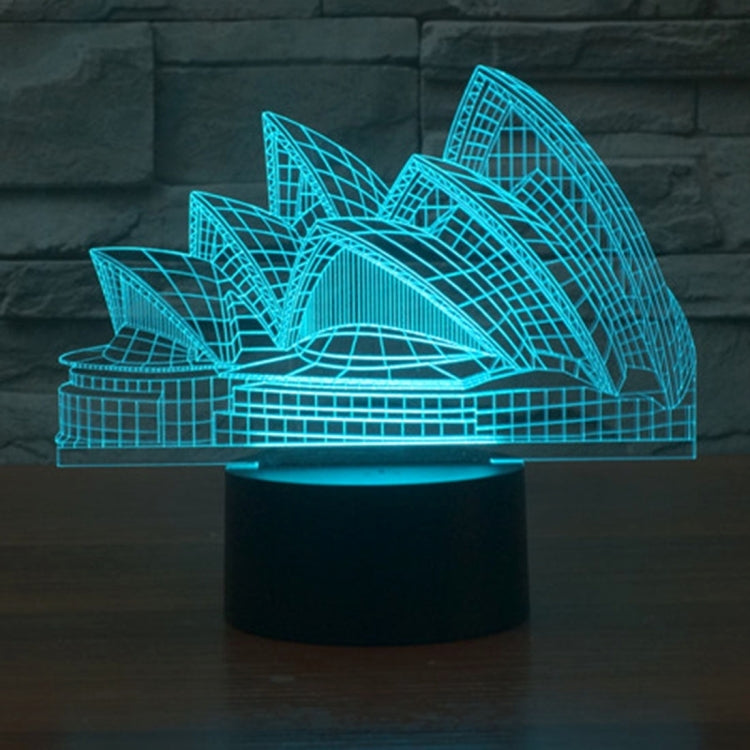 Sydney Opera House style desk lamp with blue LED line art, on black base