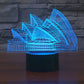 Sydney Opera House style LED desk lamp with blue glowing architectural outline