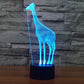 Blue glowing giraffe desk night light with black cylindrical base