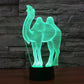 Camel wireframe LED night light on black base, turquoise green glow